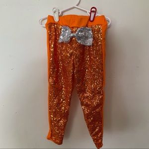 Kids Orange size 6 sequined pants.